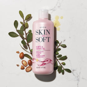 AVON lotion creamy texture close-up with jasmine petals, shows rich argan oil nourishment
