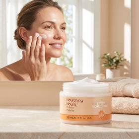AVON jar beside coin for scale emphasizing travel-friendly size benefit
