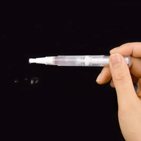 Awpeye beside a coin for scale demonstrating compact 3ml size benefit