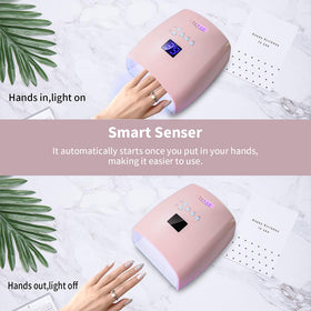 Ayshone lamp next to hand showing size and portability advantage
