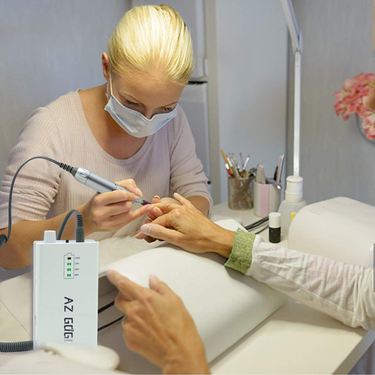 AZ GOGO in use during a salon manicure demonstrating quiet operation and control