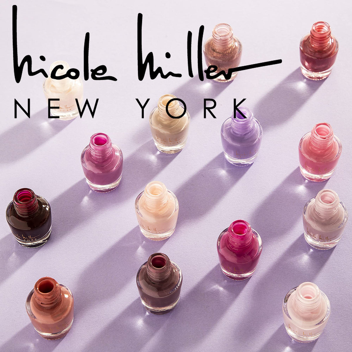 B.C BEAUTY CONCEPTS Nicole Miller bottle close-up showing brush and smooth application