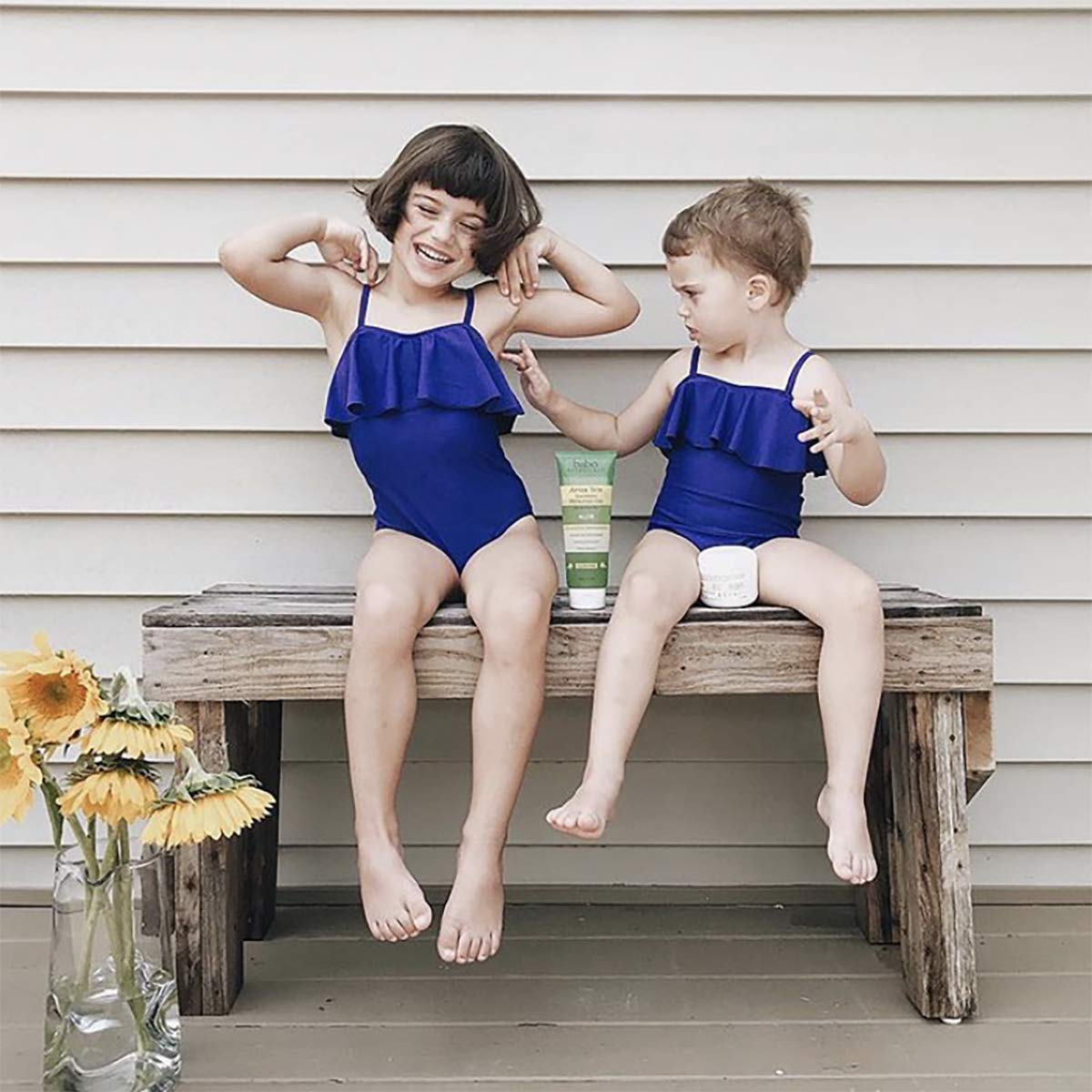 Babo Botanicals applied on child at beach showing family-safe use