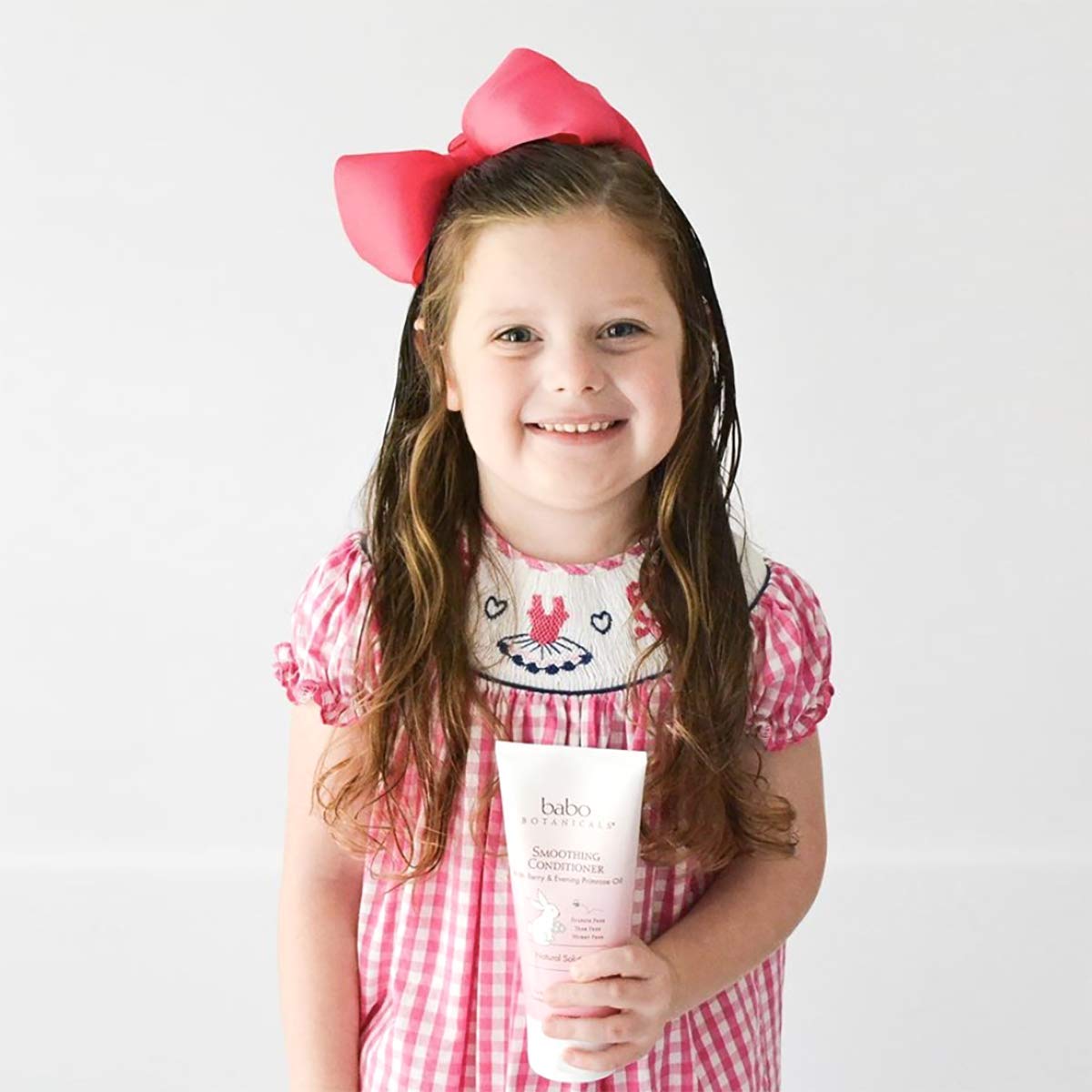 Babo Botanicals conditioner on bathroom shelf in lifestyle scene conveying calm routine