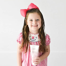 Babo Botanicals conditioner on bathroom shelf in lifestyle scene conveying calm routine