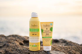 Babo Botanicals lotion dispensed on hand showing non-greasy absorbency