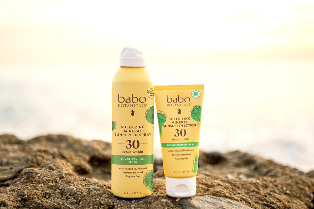 Babo Botanicals lifestyle beach scene showing water-resistant sun protection