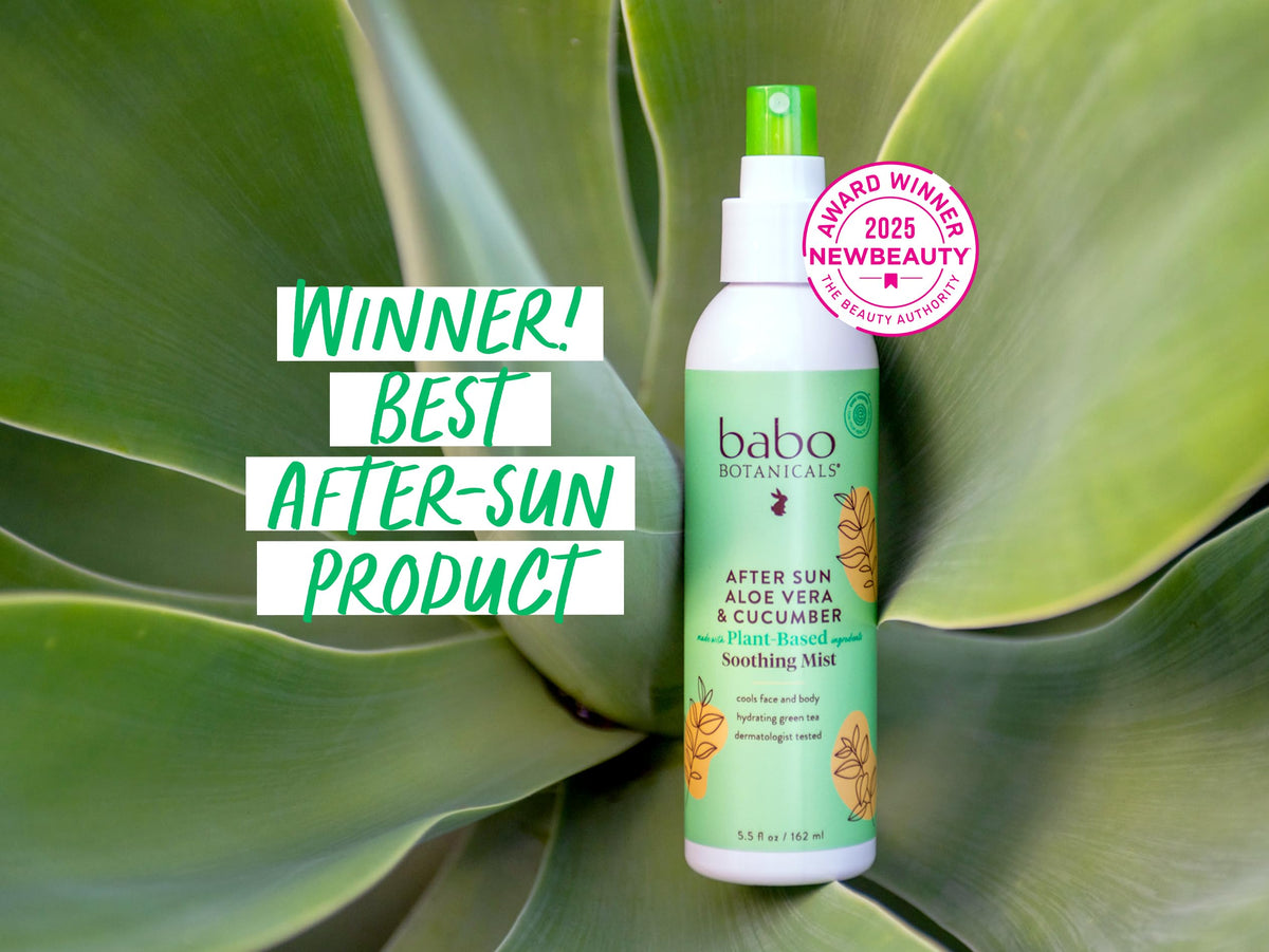 Babo Botanicals 8 oz bottle next to beach bag illustrating size