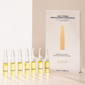 BABOR pouring ampoule onto fingertips for easy, hygienic application
