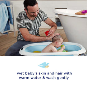 Baby Dove in use during baby bath demonstrating tear-free comfort