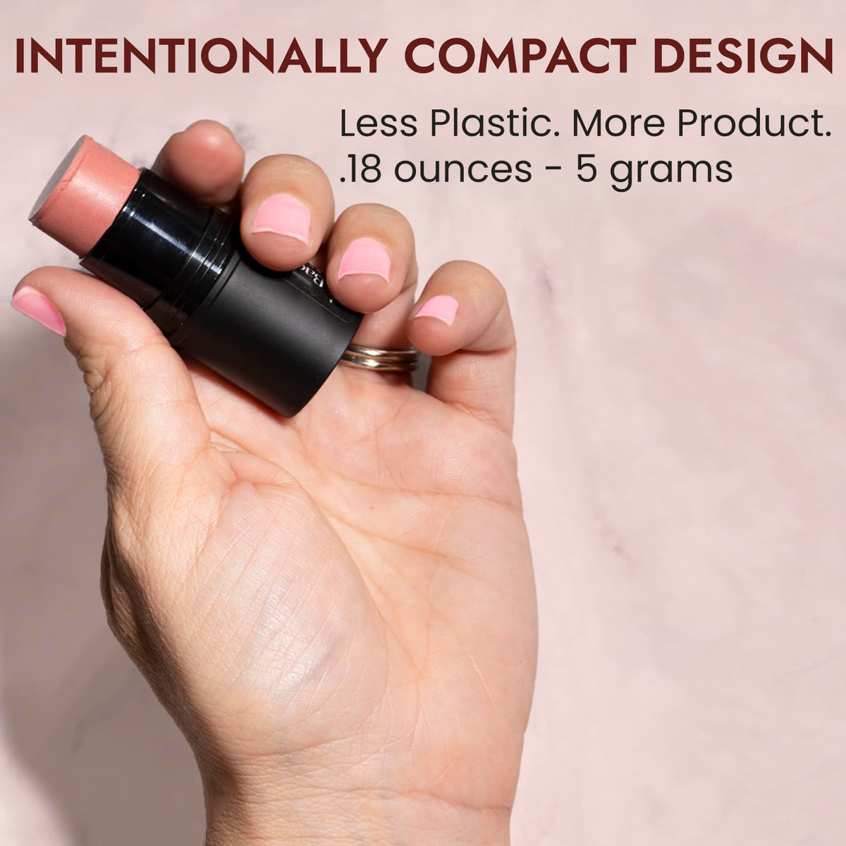 BaeBlu held in hand to show compact travel-friendly size