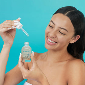 Baebody bottle styled on nightstand to show nightly skincare ritual benefit