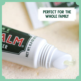 Bag Balm in outdoor setting on a jacket pocket showing protection and on-the-go hydration