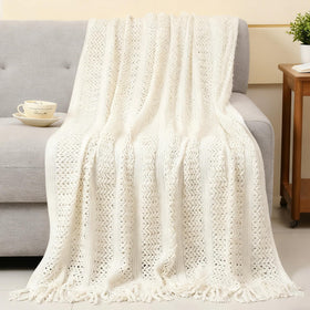BaiCai lifestyle relaxing ritual with blanket, candle, and mug for tranquility