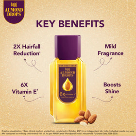 Bajaj Almond Drops ingredients label close-up showing almond oil and 6X Vitamin E benefit