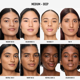 bareMinerals brush buffing powder on model cheek for natural matte coverage benefit