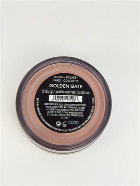 bareMinerals jar in hand showing size and portable convenience