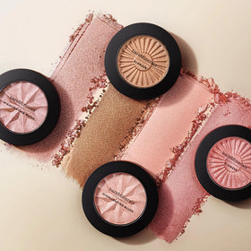 bareMinerals compact next to coin showing product size and on-the-go ease
