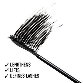 bareMinerals size scale next to coin showing full-size tube portability
