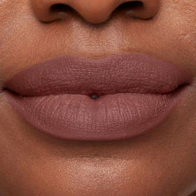 bareMinerals creamy texture swatch on arm demonstrating rich pigment and smooth glide