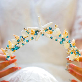 BARTOSI crown beside a ruler revealing the 14cm by 8cm size for scale and fit