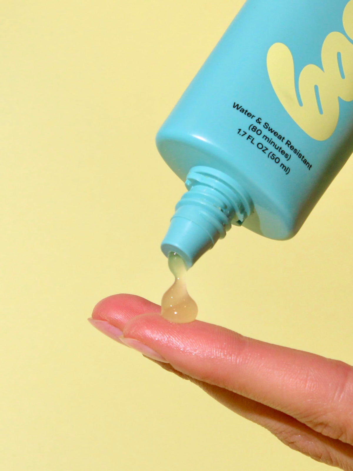 Bask clear gel on hand demonstrating invisible finish and hydration