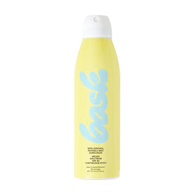 Bask sunscreen on towel at beach conveying water-resistant protection