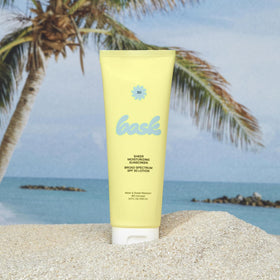 Bask sunscreen tube held in hand highlighting portable travel convenience