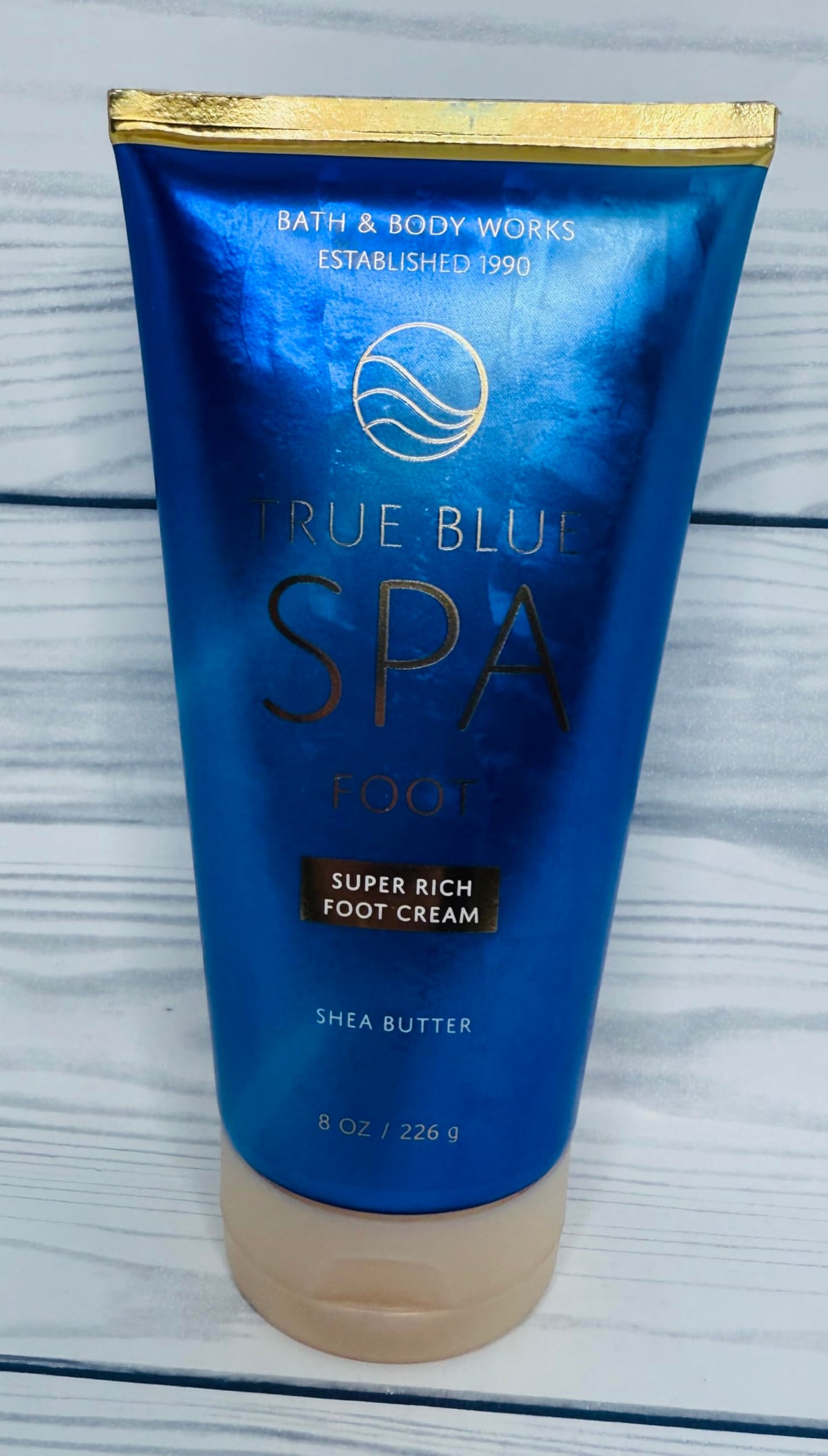 Bath & Body Works applying cream to foot demonstrating soothing hydration
