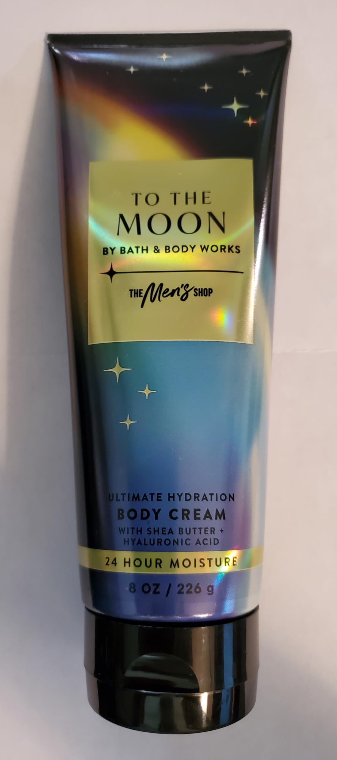 Bath & Body Works jar in hand for scale, demonstrates travel-friendly size