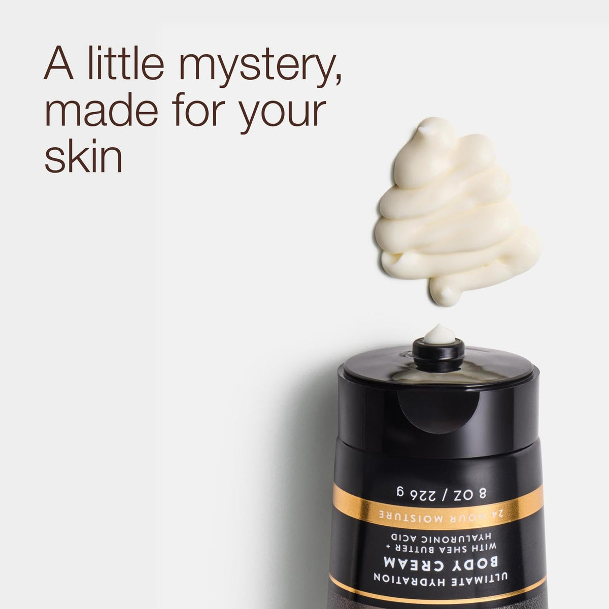 Bath & Body Works open tub texture of Noir cream demonstrating rich, smooth hydration