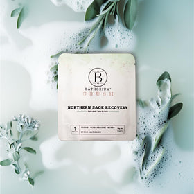 Bathorium single 4 oz bag held in hand showing compact size and travel convenience benefit