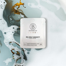 Bathorium soak dissolving in bathtub lifestyle scene demonstrating calming soak benefit
