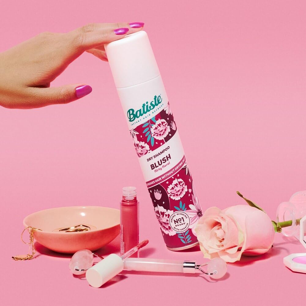Batiste used by woman on-the-go for quick freshening benefit