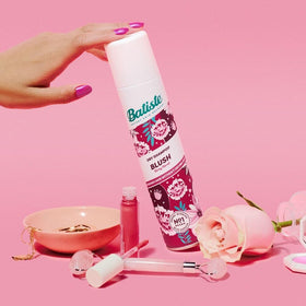 Batiste used by woman on-the-go for quick freshening benefit