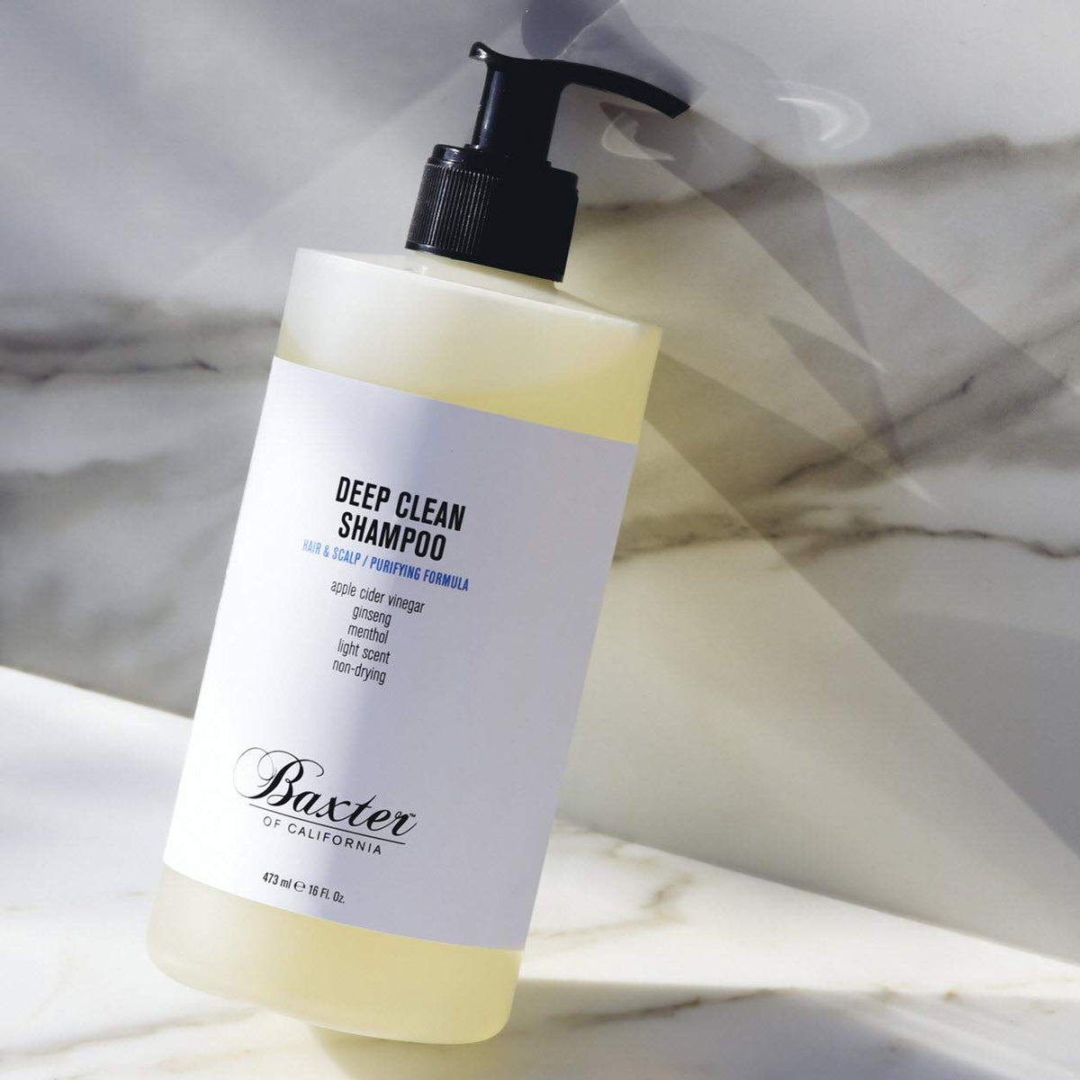 Baxter of California shampoo in use under shower demonstrating deep clean benefit