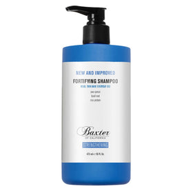 Baxter of California shampoo on shower shelf with towel for daily routine