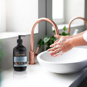 Baylis & Harding bottle placed on a kitchen counter showing fresh scent benefit: ideal for kitchens