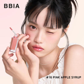 BBIA gloss held in hand to show compact size and travel-friendly design