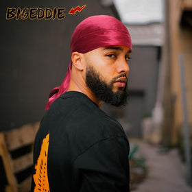 BE BIGEDDIE durag next to a hand for scale and perfect fit guidance