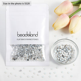 BEADSLAND rhinestones next to coin for scale showing SS20 4.6–4.8mm size clarity