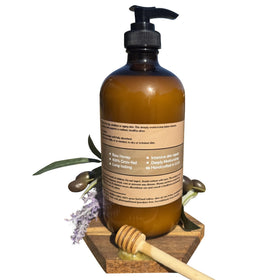 Open Bear Bird jar displaying rich honey-infused cream that absorbs for soft skin