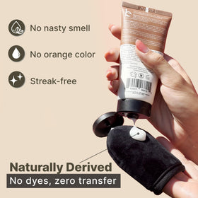 Beauty by Earth face tanner lotion on hand while applying for even, streak-free finish