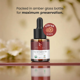 Beauty by Earth bottle beside a hand showing product size