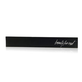 Beauty For Real open tube with wand detail, highlights precision bristles