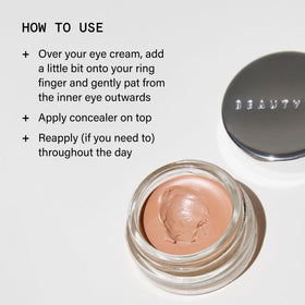 Beauty Pie application demonstration patting product under eye for natural coverage and hydrated finish