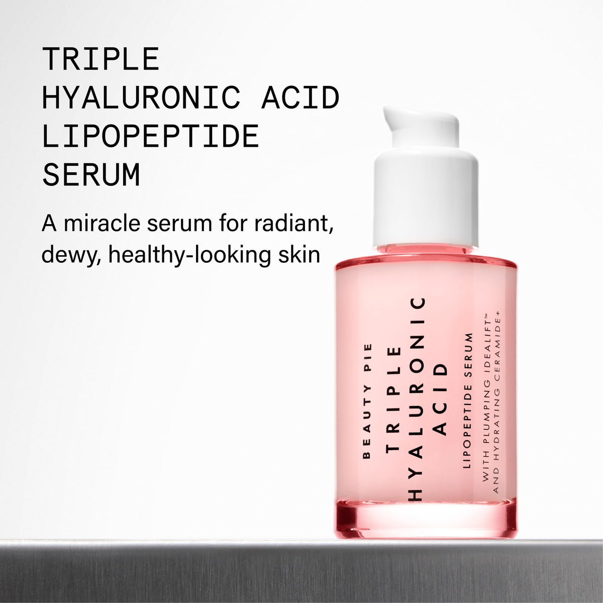 Beauty Pie serum droplet on fingertip showing silky texture and quick absorption