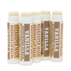 Beekeeper Made lip balm tin in hand illustrating size and portability benefit