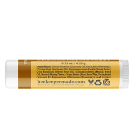 Beessential tube open applied to lips demonstrating moisturizing finish