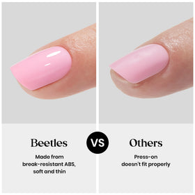 Beetles model wearing short almond nails showing practical everyday elegance